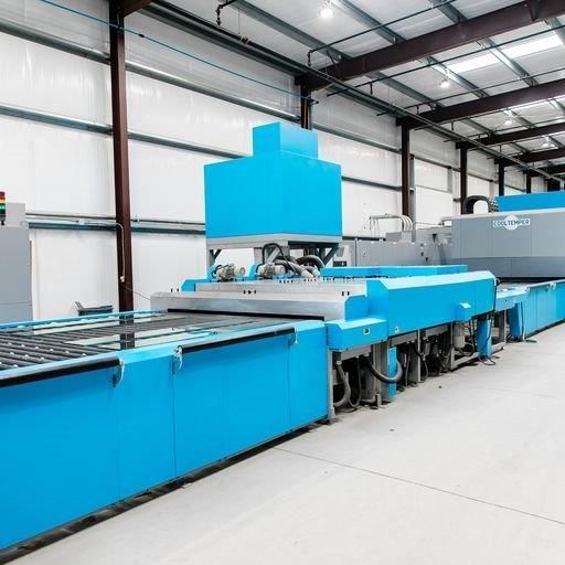 A Blue and Gray Machine Is Sitting Inside of A Building - Buford, GA - EGM Tempering