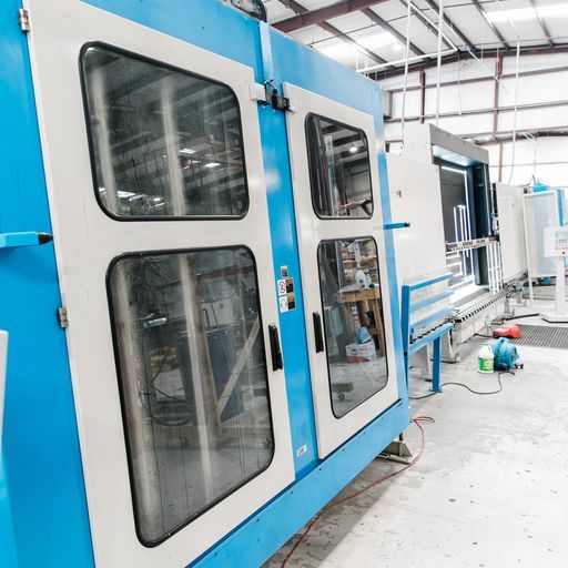 A Blue and White Machine in A Factory with A Sign that Says ' a ' on It - Buford, GA - EGM Tempering