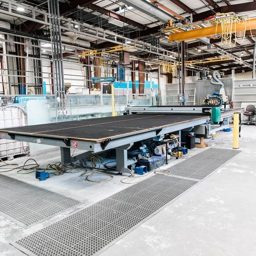 A Large Machine Is Sitting on Top of A Table in A Factory - Buford, GA - EGM Tempering