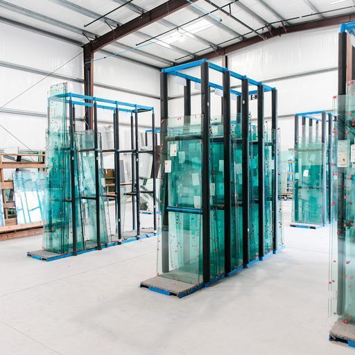 A Warehouse Filled with Lots of Glass Stacked on Top of Each Other - Buford, GA - EGM Tempering