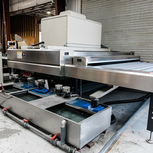 A Large Stainless Steel Machine Is Sitting in A Warehouse - Buford, GA - EGM Tempering