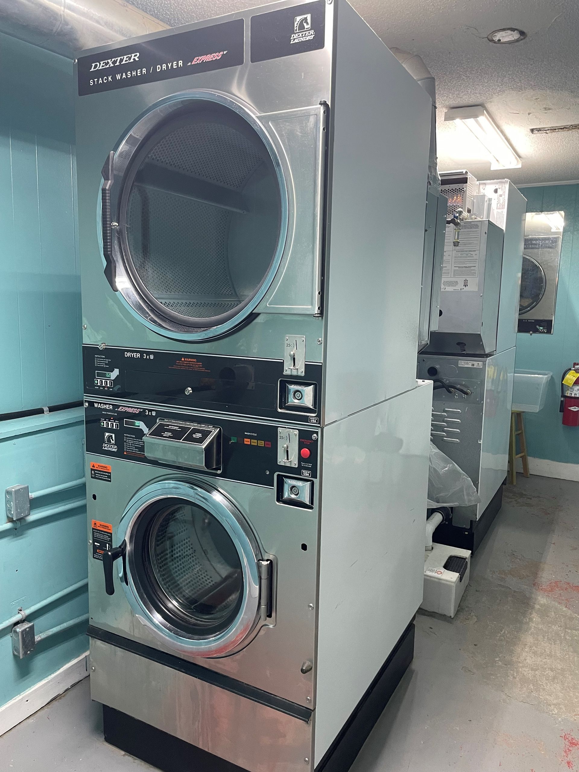 A large washer and dryer in a laundromat