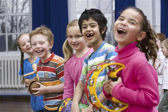 young children laugh during a music lesson
