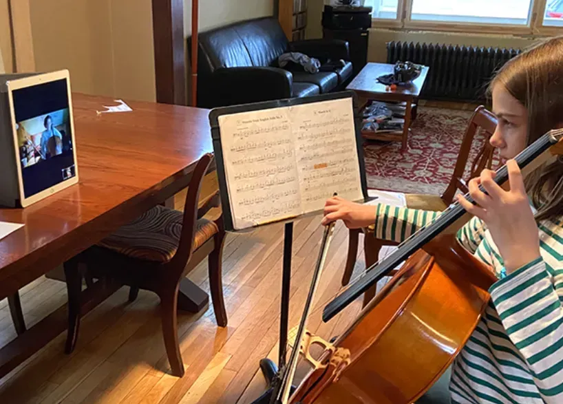 Child attending a virtual music lesson
