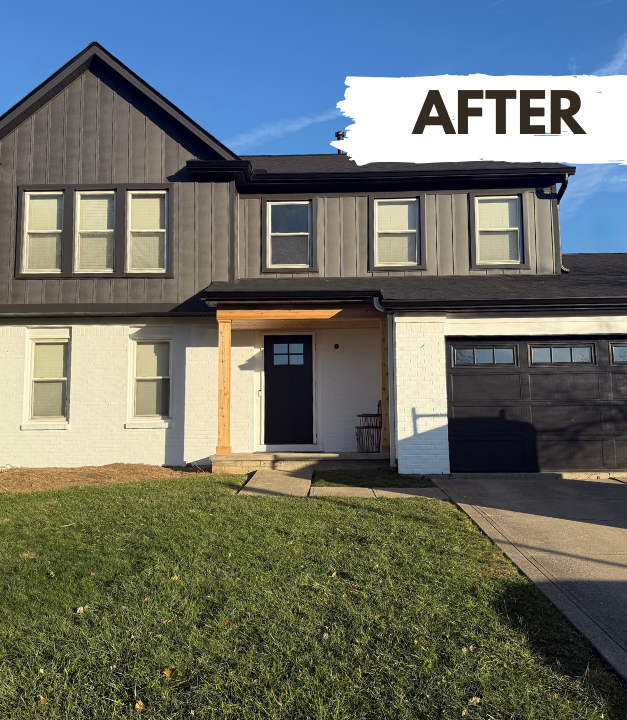 Two-story house with white siding, green doors, and a porch. Brown grass in front, and a brick house to the right.