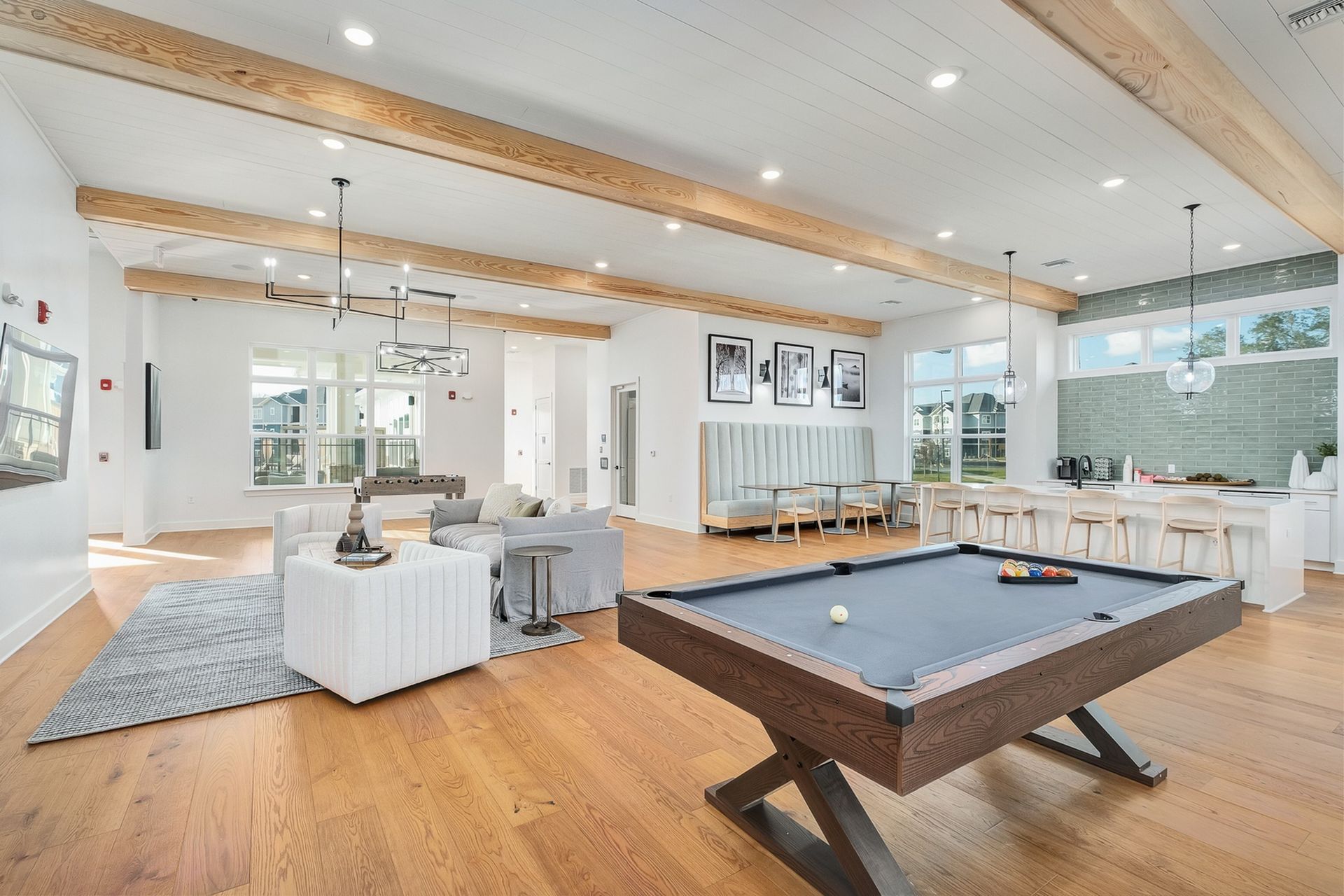 There is a pool table in the middle of the resident lounge.