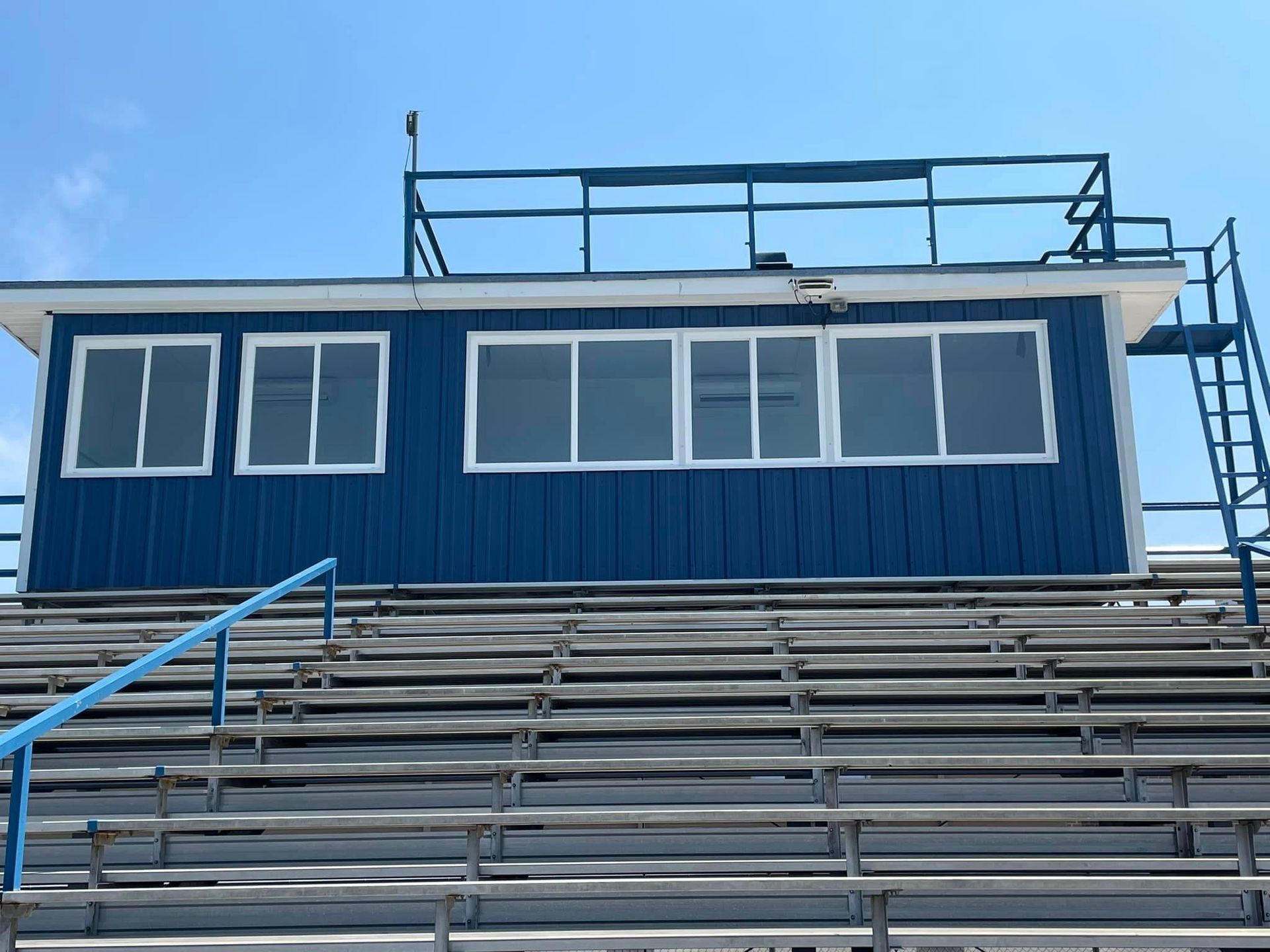 A blue building with stairs leading up to it