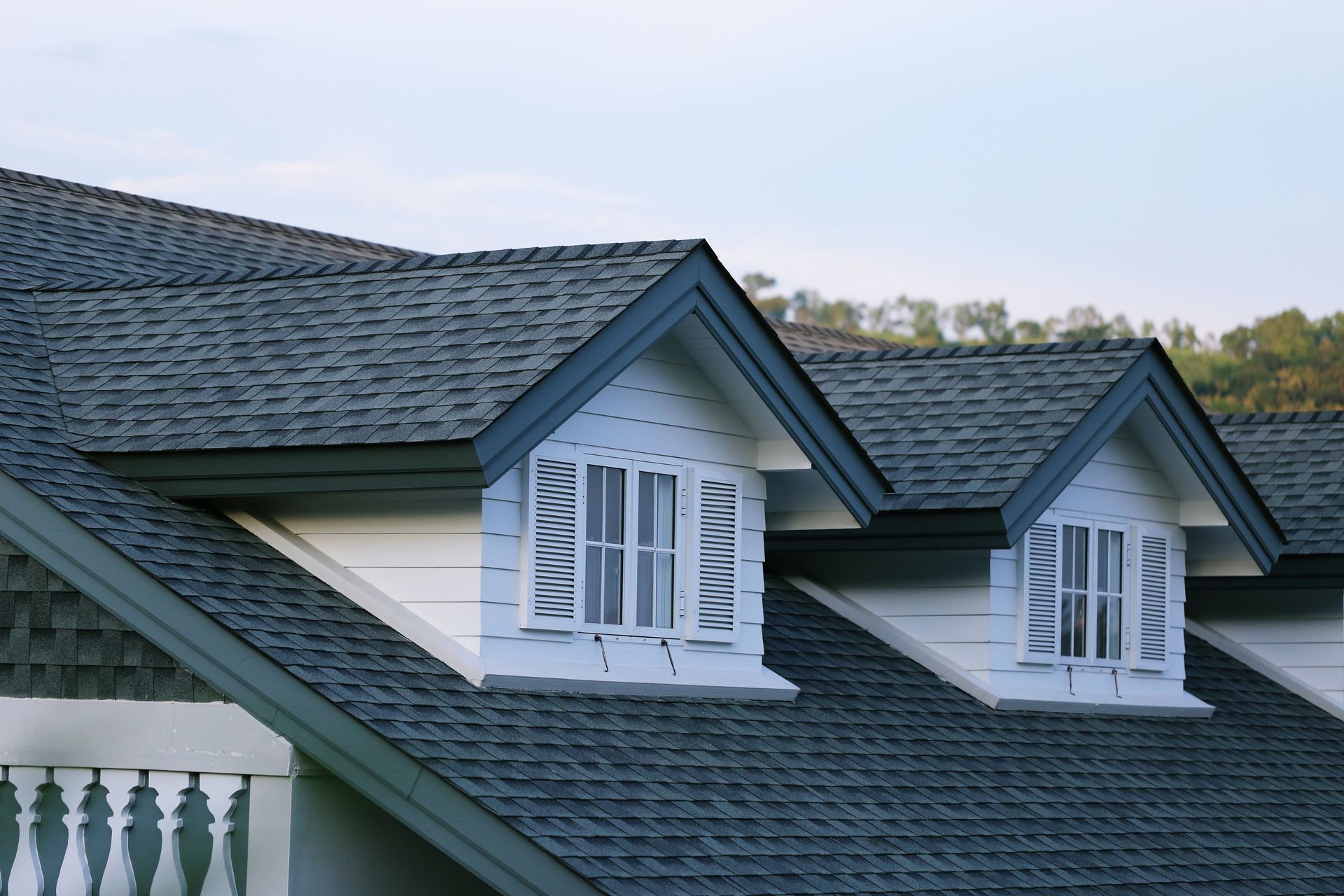 The roof of a house has a lot of windows on it