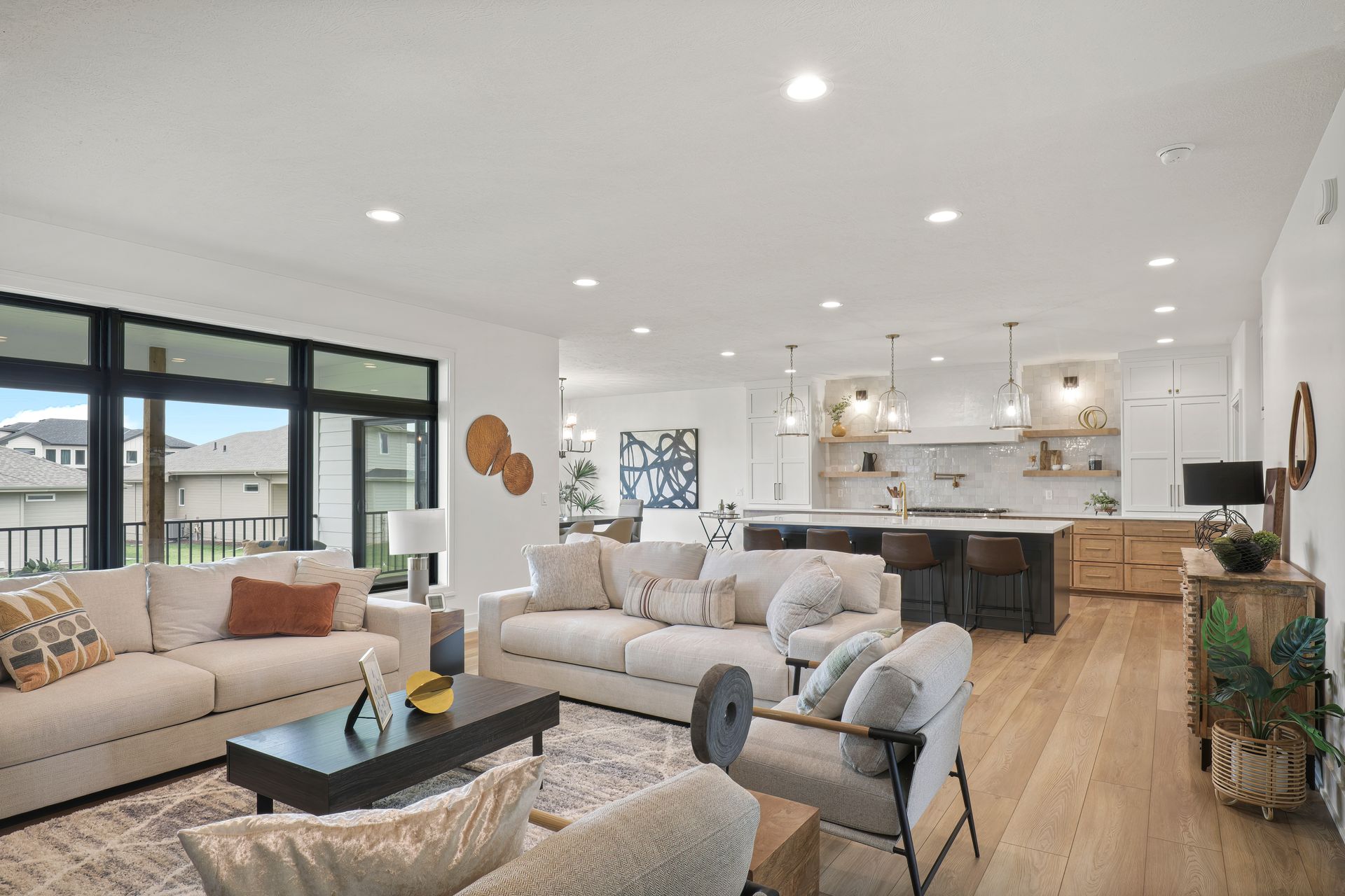 A living room with a couch , chairs , and a coffee table.