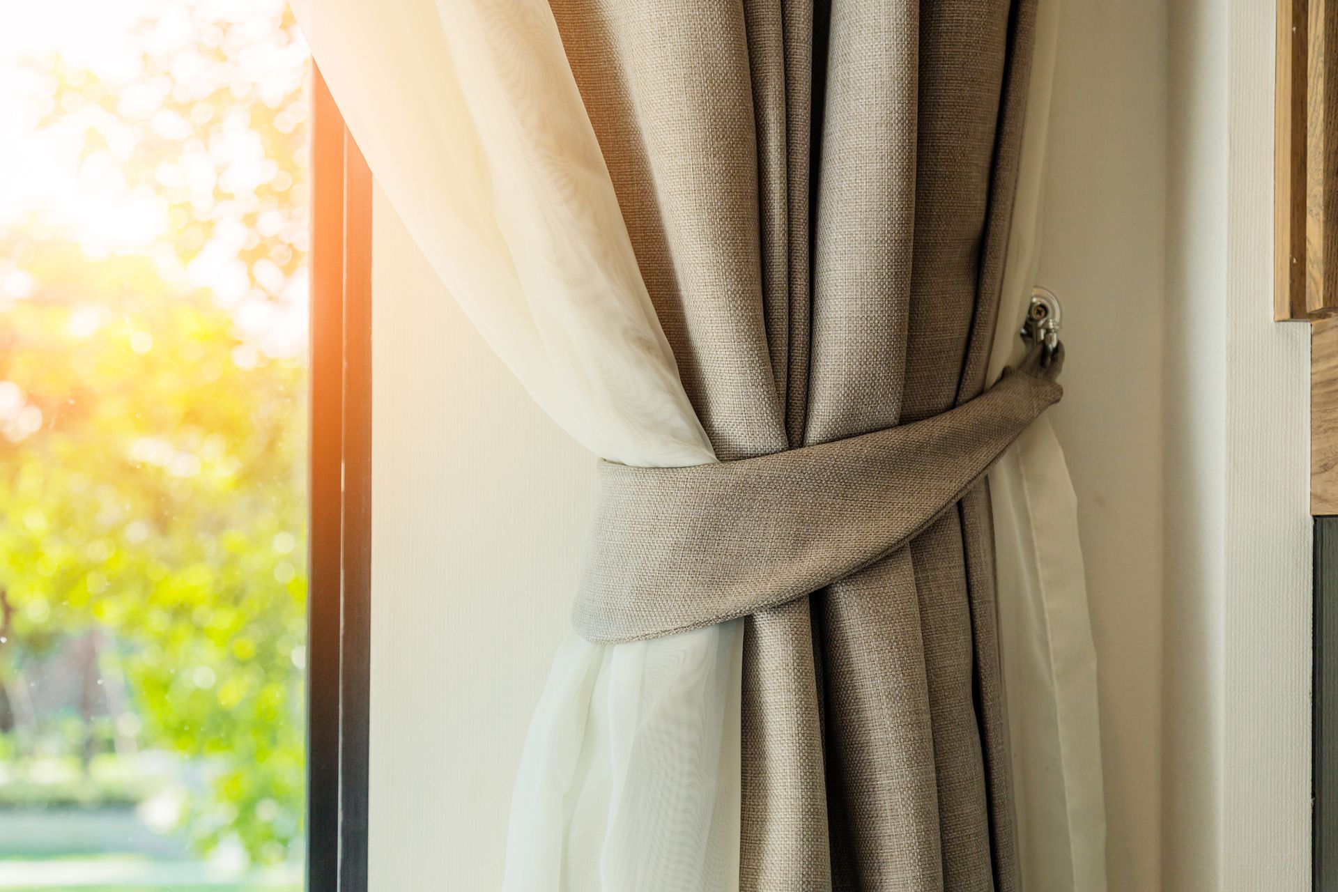Brown Curtain with Beautiful Sun Light — Bundaberg, Qld — Andersons Curtains & Blinds