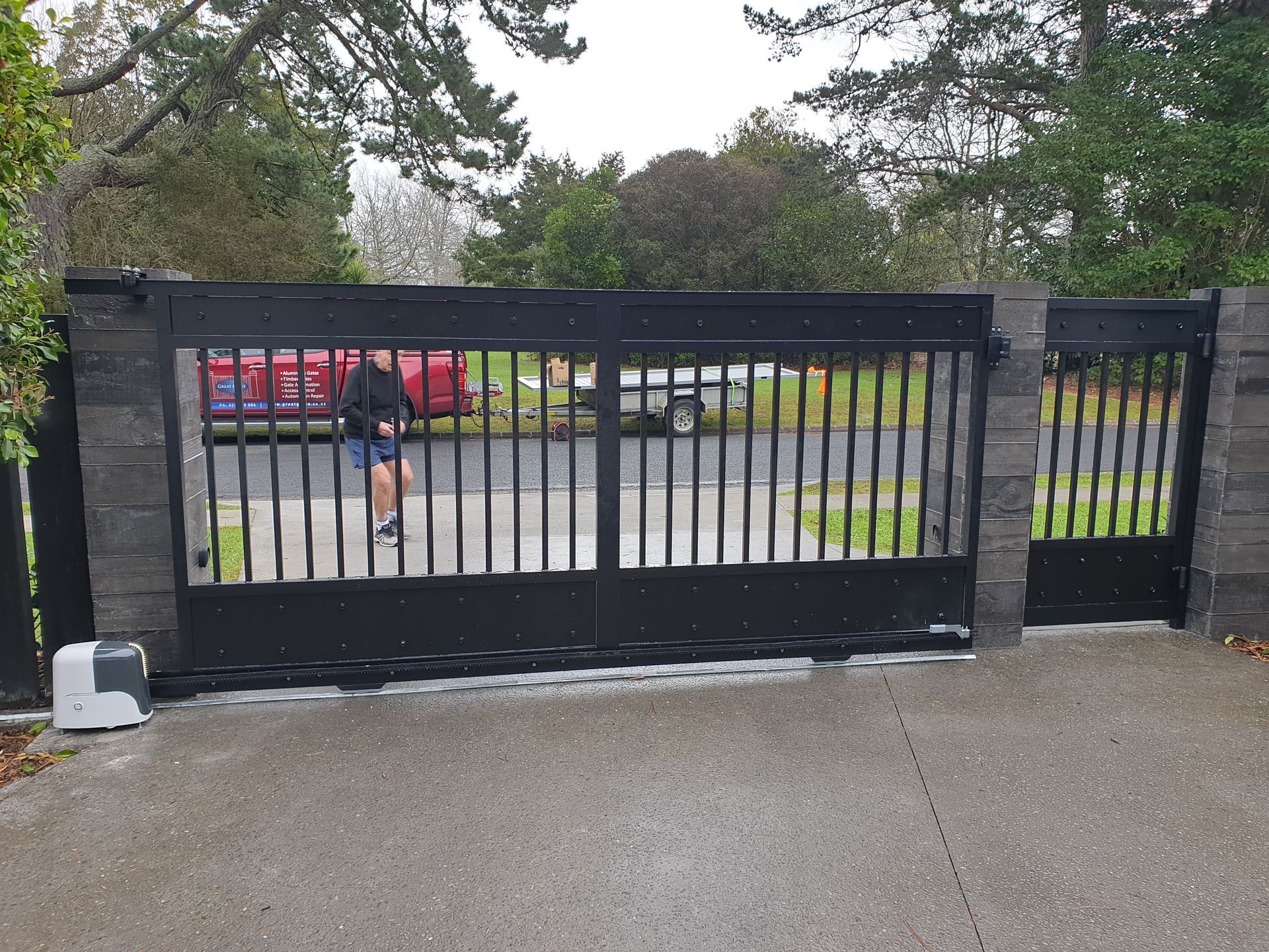 A person is walking through a gate that is open