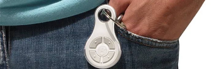 A person is holding a remote control in their pocket.
