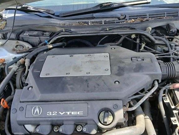 A close up of a car engine with the word vtec on it