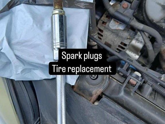 Spark plugs and tire replacement are shown on a car