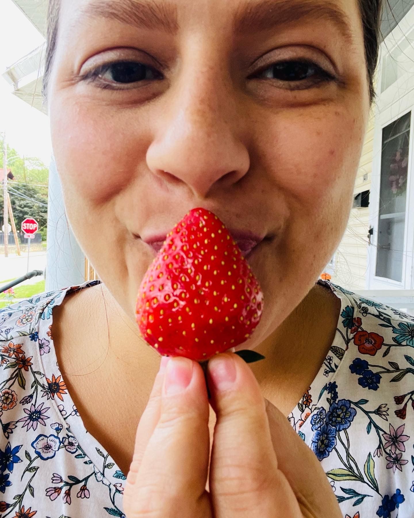 kissing a strawberry
