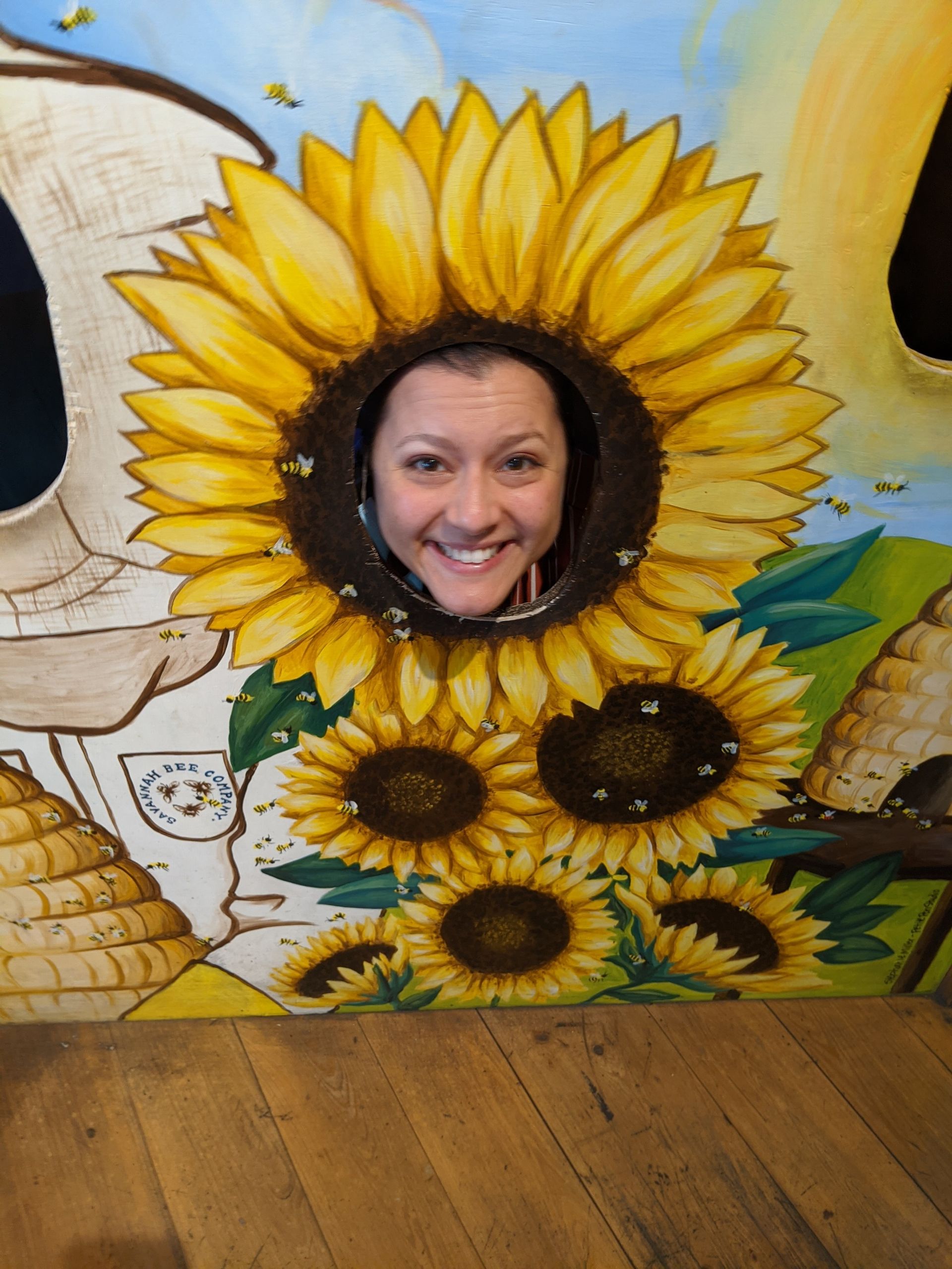 face inside a sunflower cutout