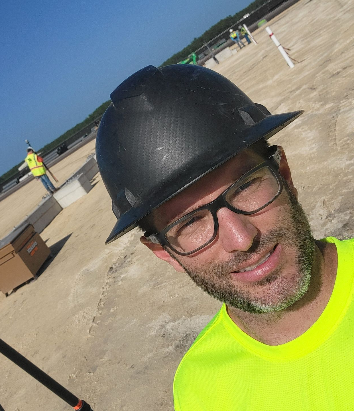 Man performing anchor bolt measurements using terrestrial LiDAR on a bright, sunny day in Jacksonville, Florida.