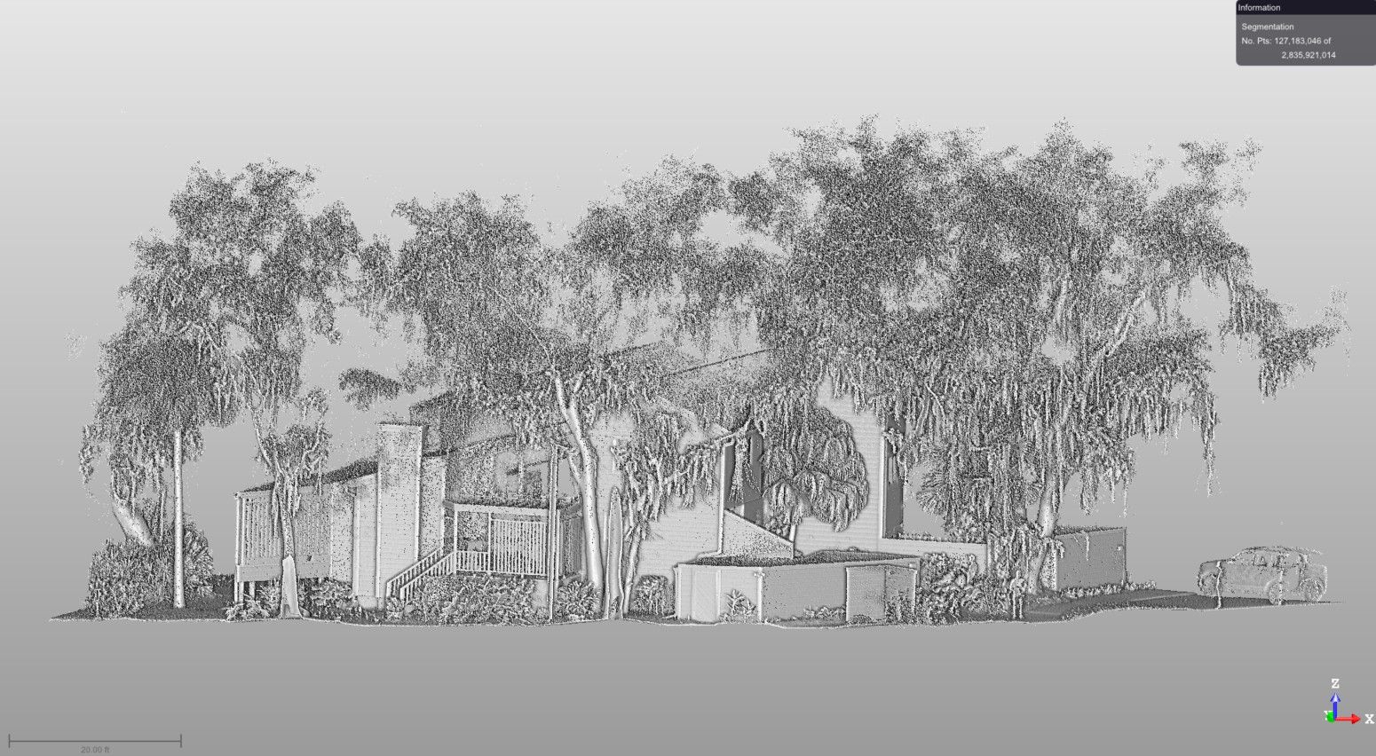 Terrestrial LiDAR point cloud data set of a multi-family renovation project. The building is engulfed with large, towering oaks and other vegetation.