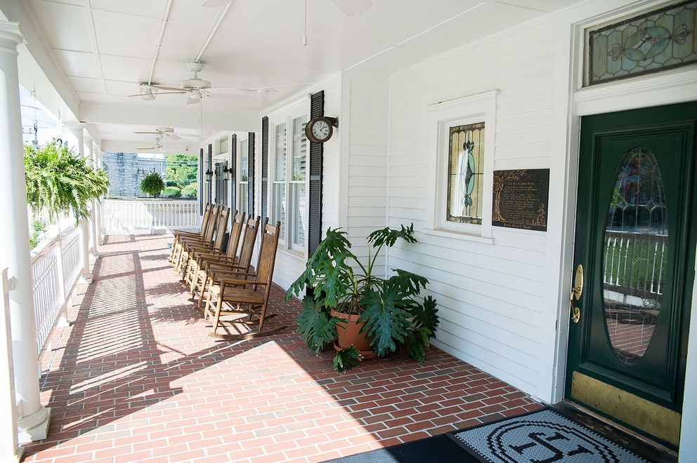 A fountain in a park with palm trees in the background