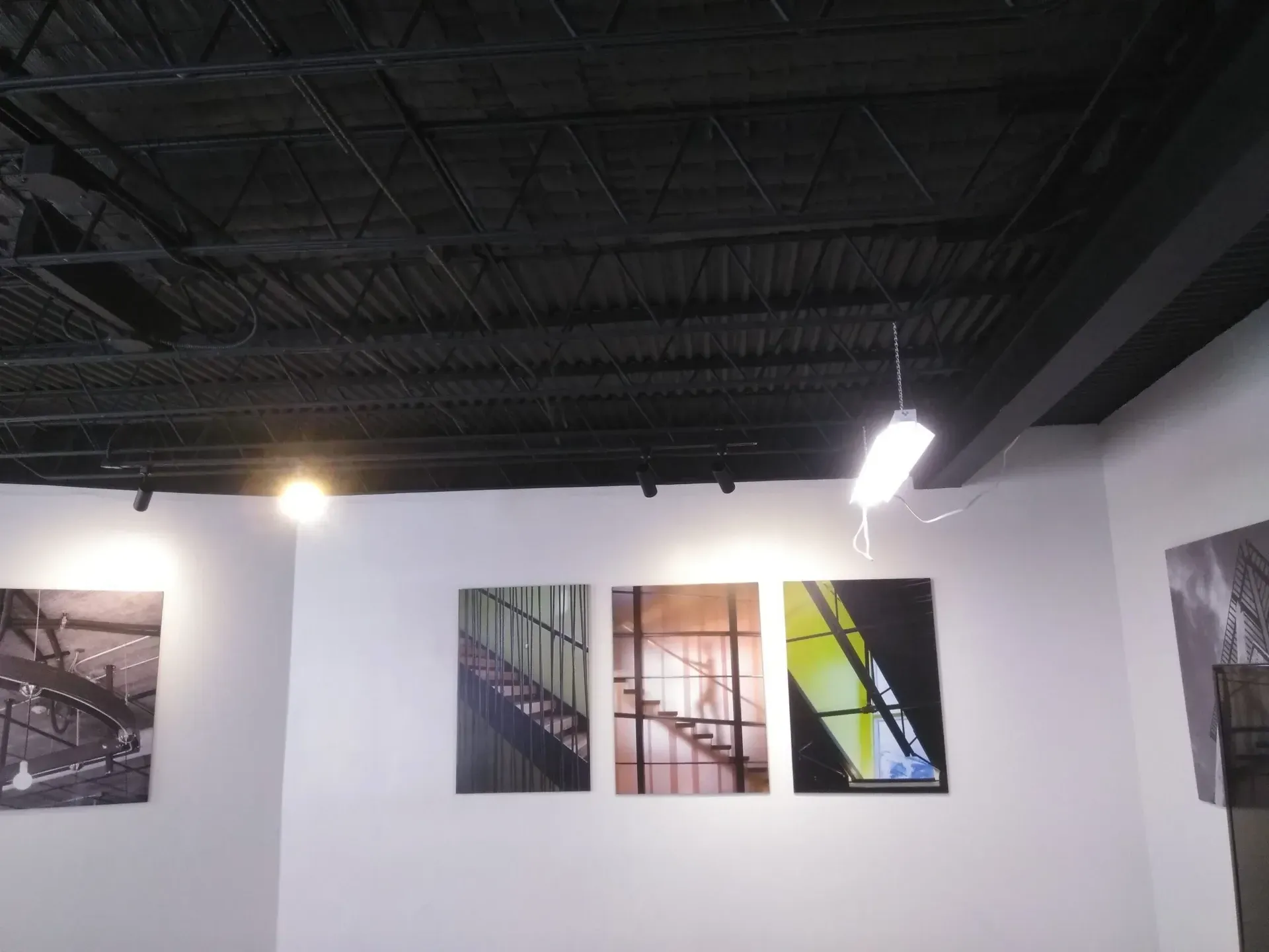 A room with a lot of pictures on the wall