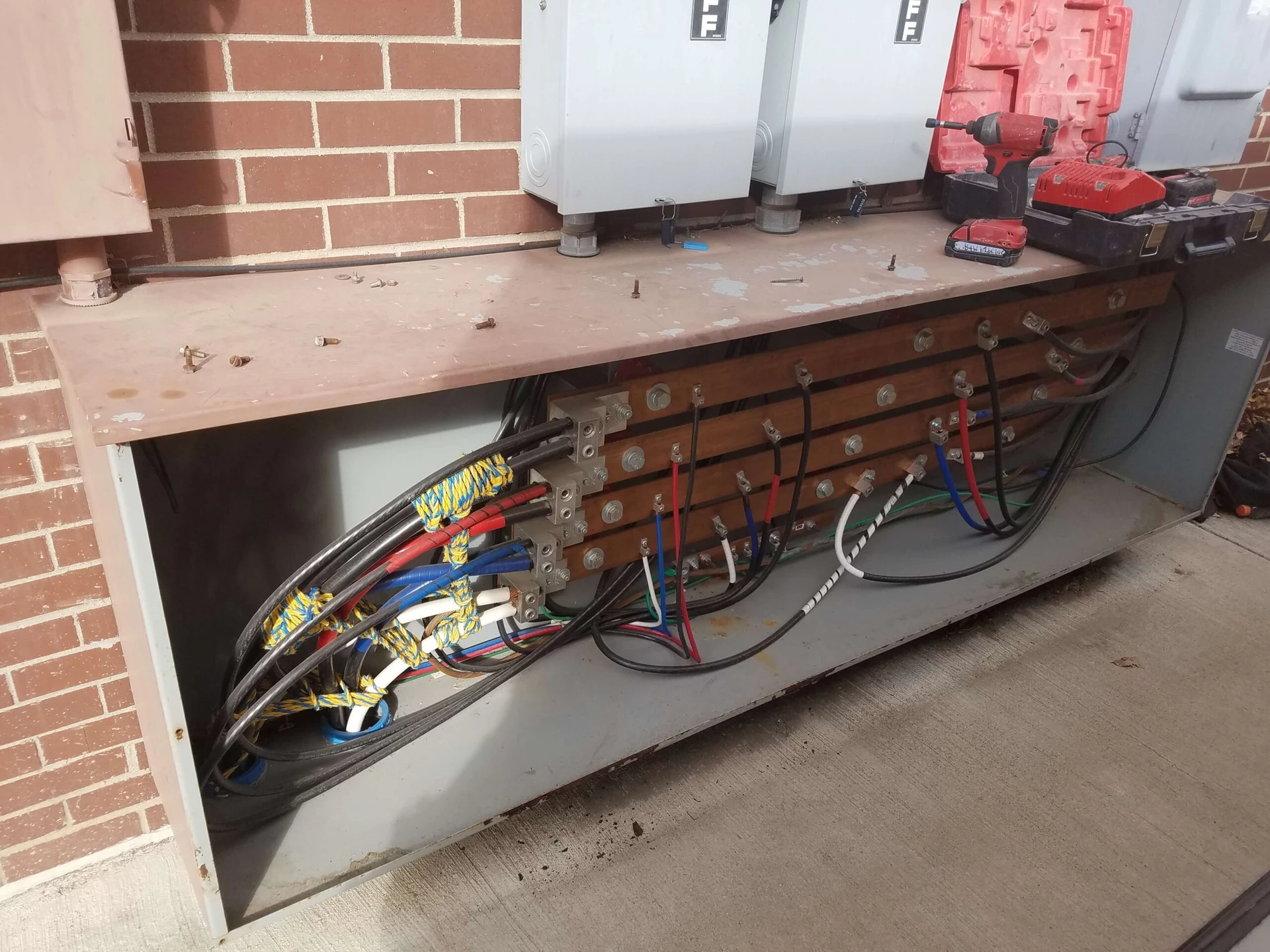 A box with a lot of wires coming out of it.