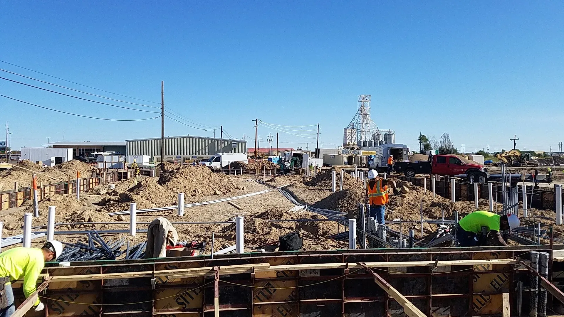 A group of construction workers are working on a construction site.
