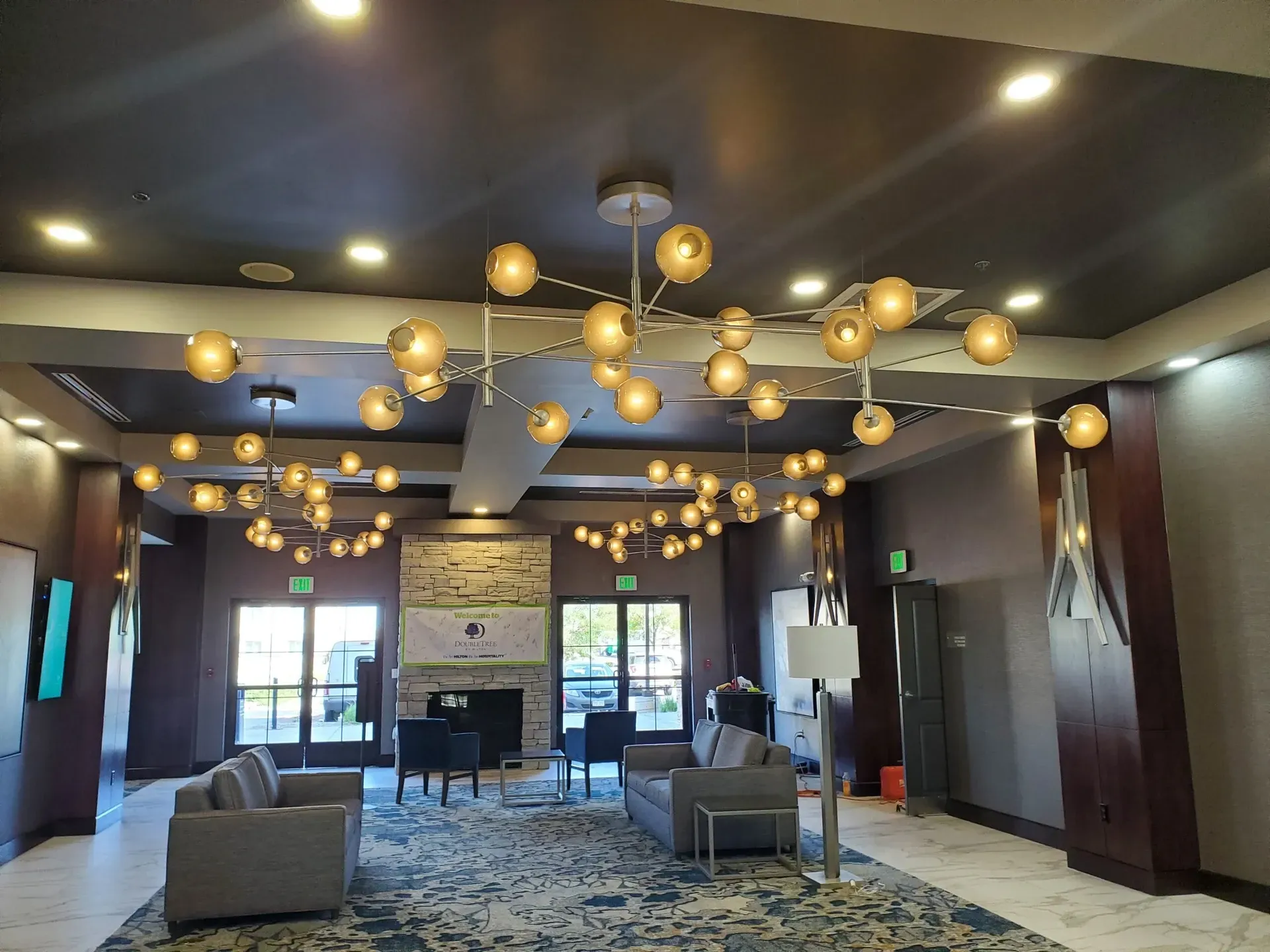 A large room with a lot of lights hanging from the ceiling