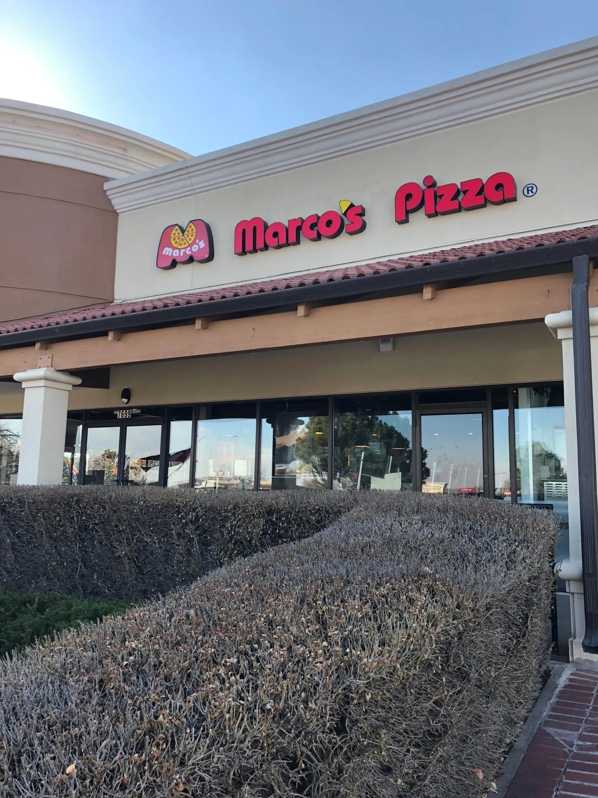 The front of a marco 's pizza restaurant