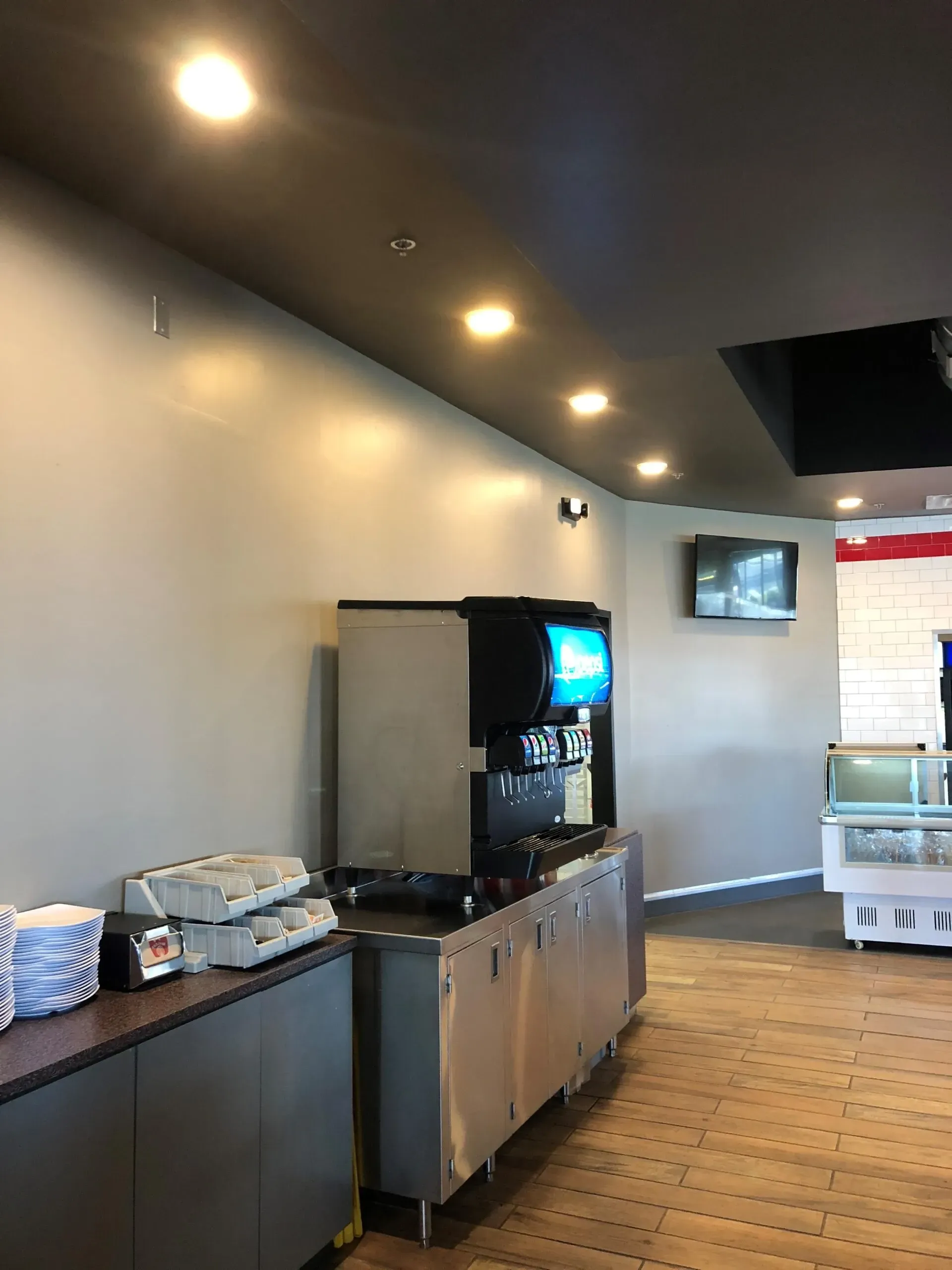 There is a drink dispenser in the middle of the room.