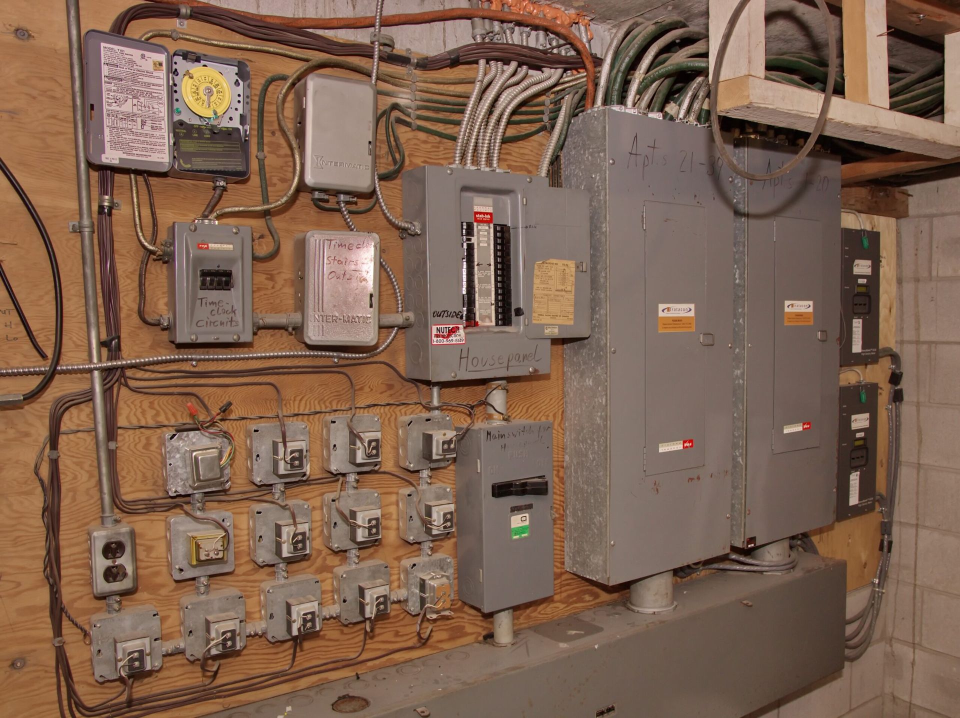 A wall with a lot of electrical equipment on it
