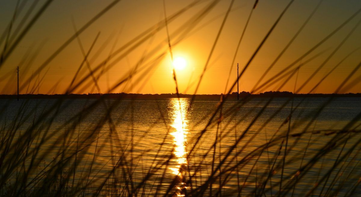 A sunset you could see during a vacation to discover Olde Naples. 
