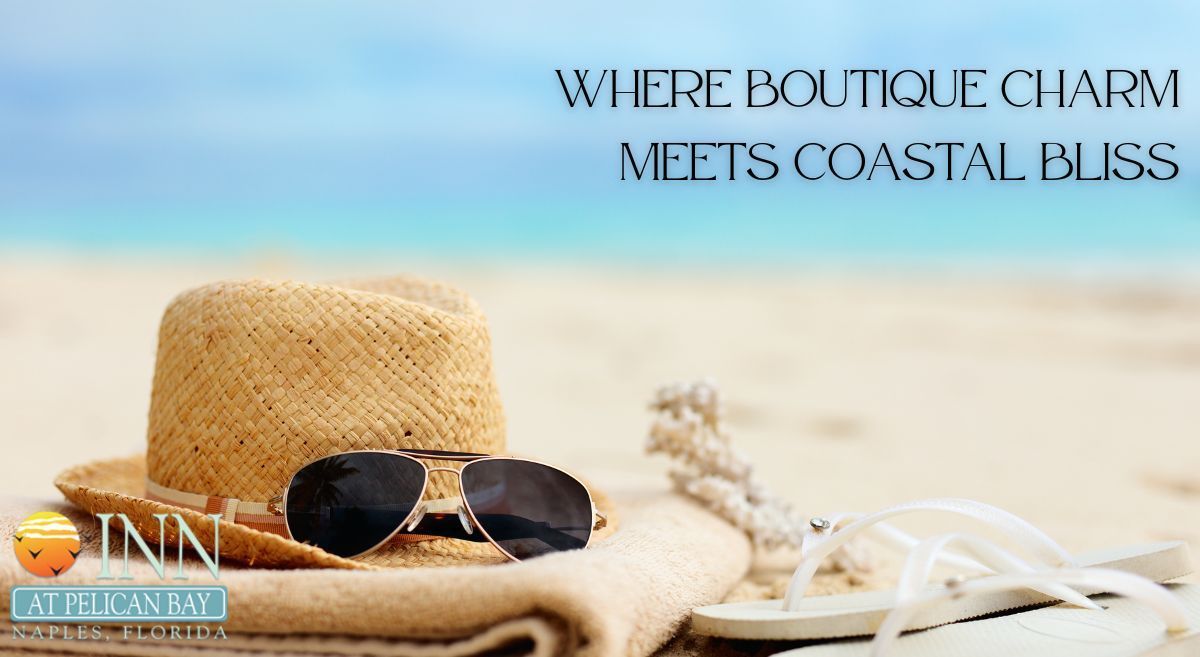A hat and sunglasses on the beach represent a boutique vacation in Naples, FL. 