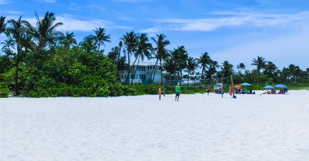 People enjoying Vanderbilt Beach