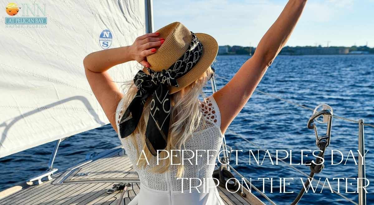 A woman on a boat enjoying a perfect Naples day trip on the water.