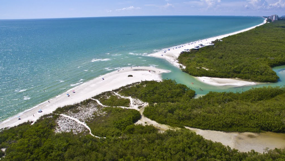 An aerial view of a beach with a river running through it