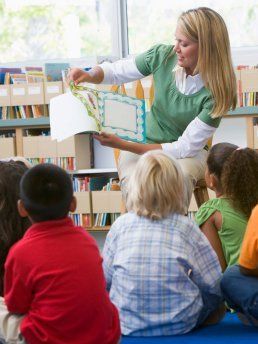 Teacher reading book to Preschool class- Cottage School , Boulder , Colorado