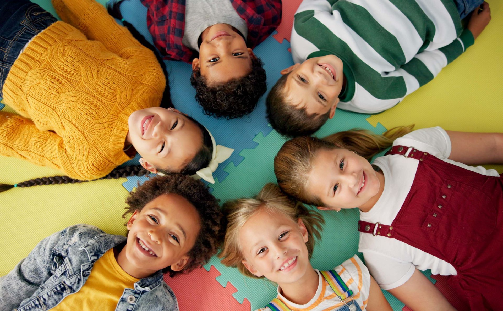 Happy kids in a circle on a mat | Preschool program | Boulder, CO Happy kids in a circle on a mat | Preschool program | Boulder, CO