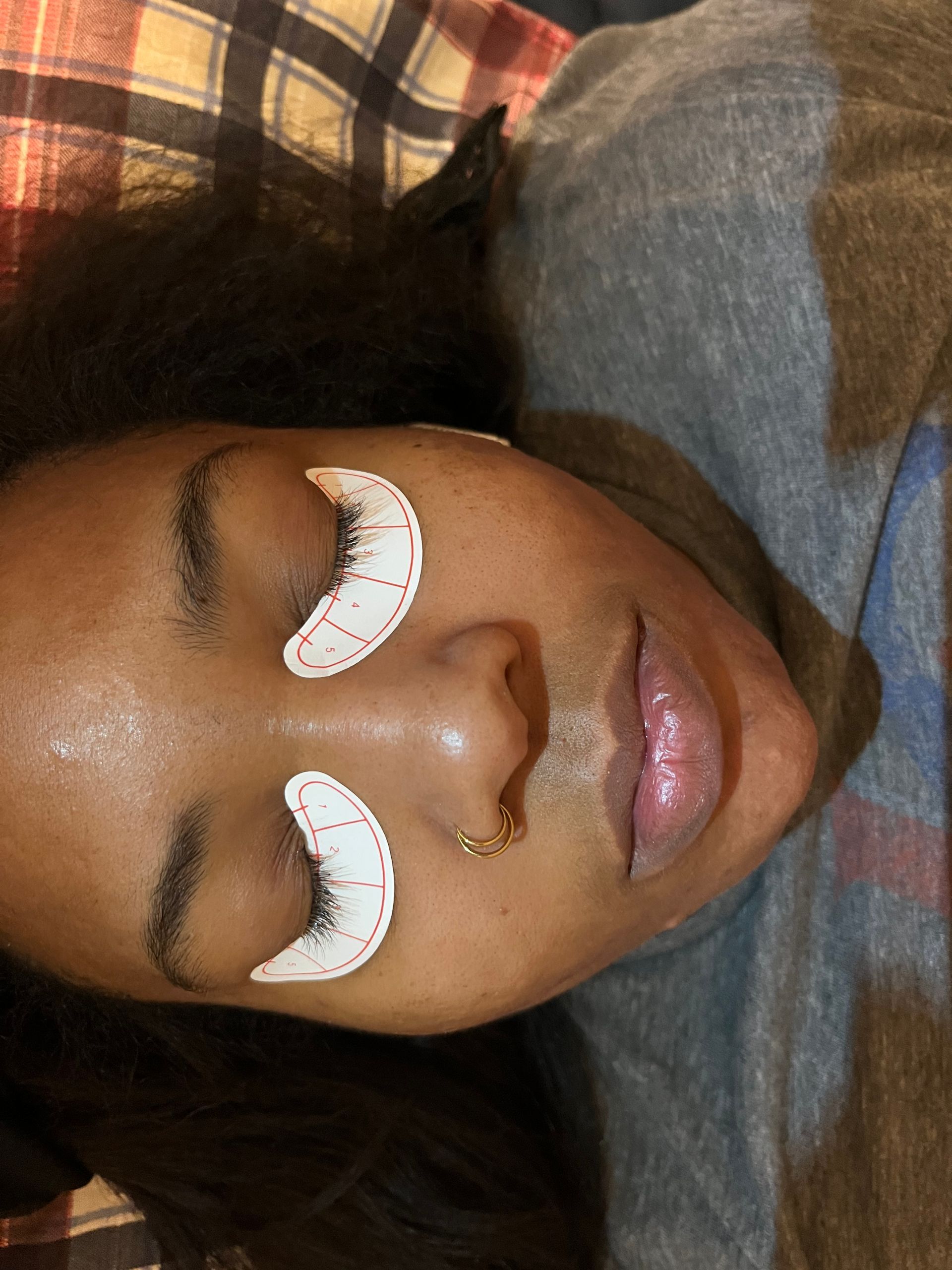 A close-up of a person's face with eyes closed.