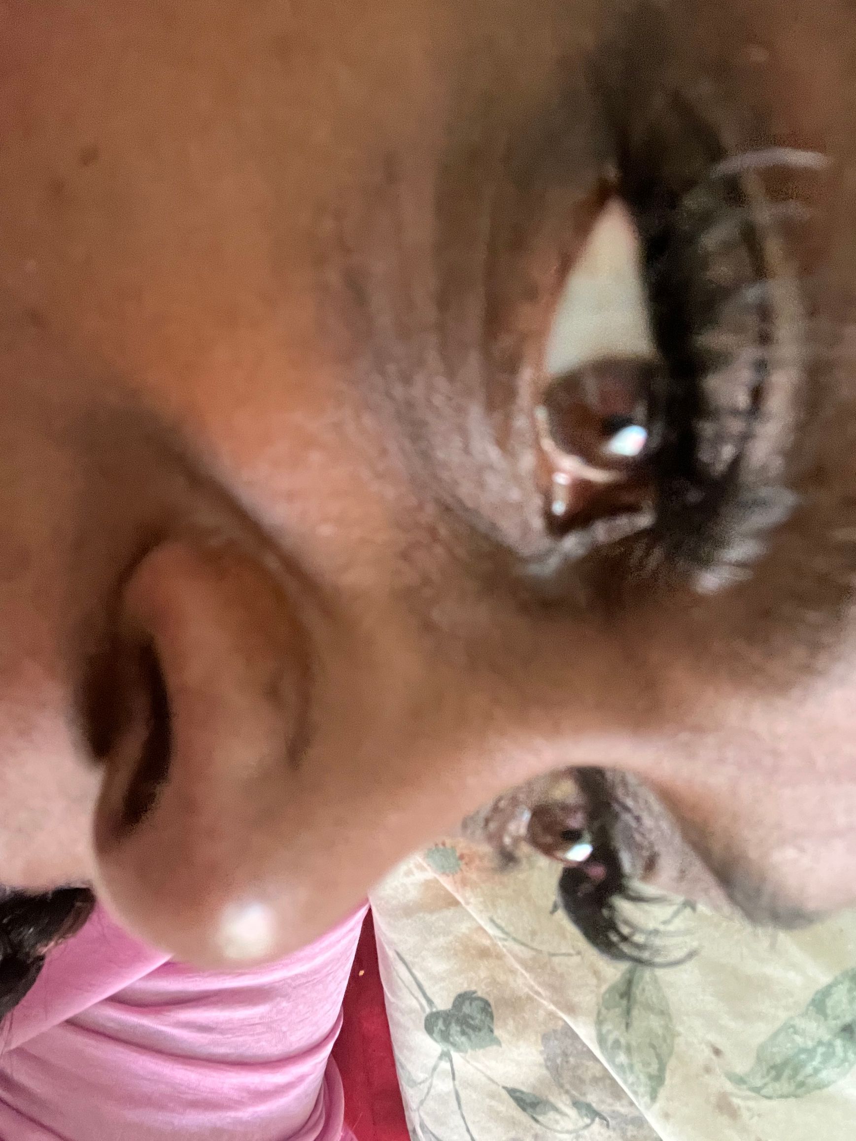 A close-up of a person's face with eyes open.