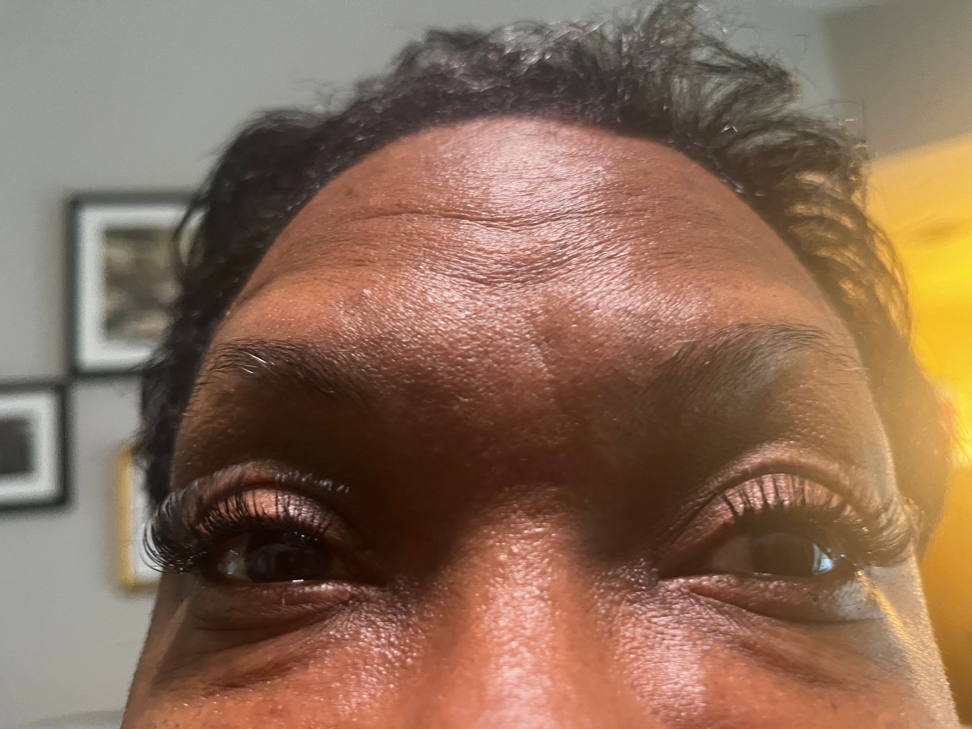 A close-up of a person's face with eyes open