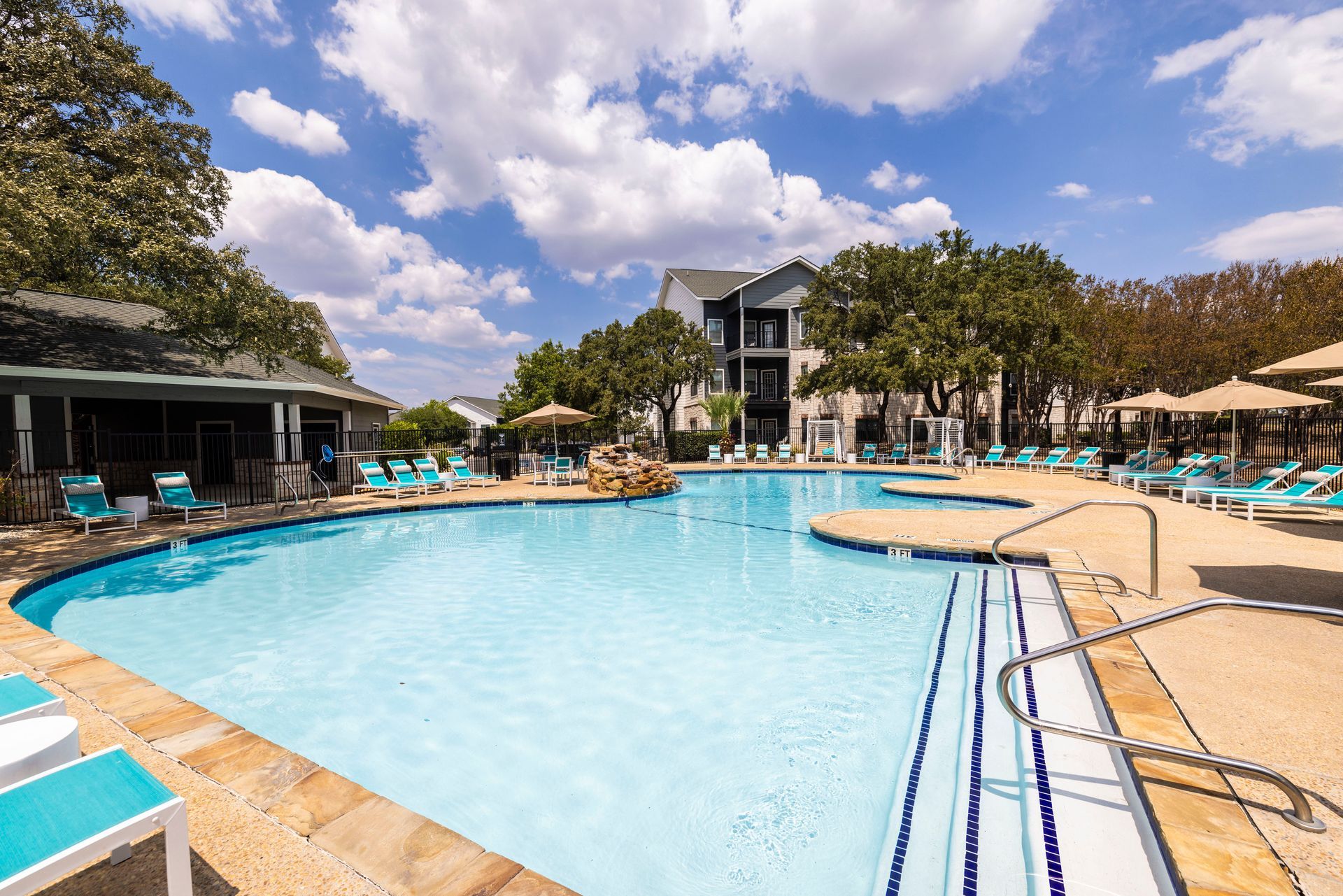 There is a table and chairs in the middle of the room.