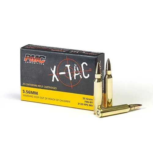 Box of PMC X-TAC 5.56mm rifle cartridges with three rounds in front. The box is black, yellow, and red.