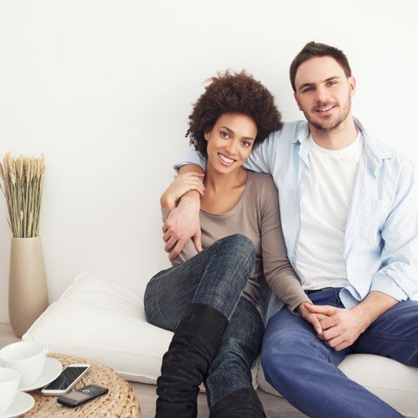 image of couple cuddling on the couch