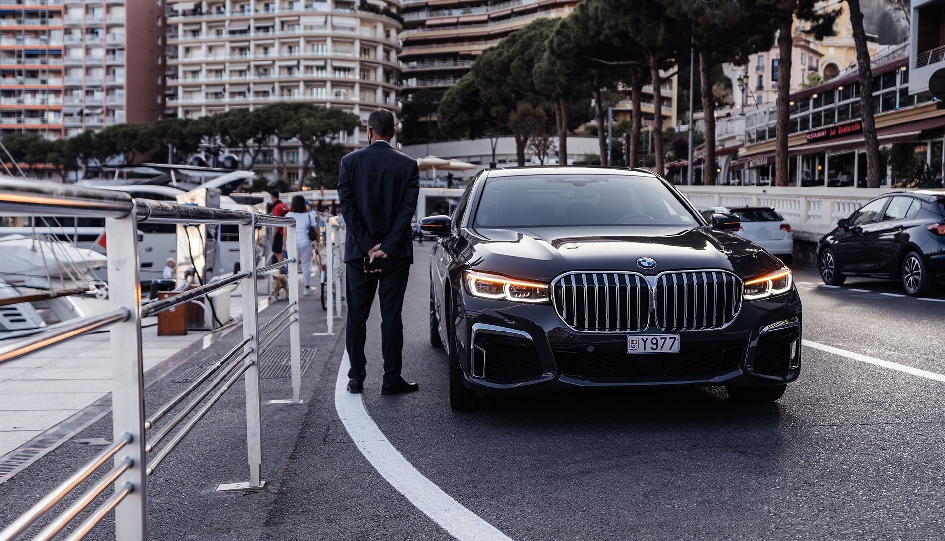 House under renovation, with paint cans and ladders. Exterior has white and brown sections.
