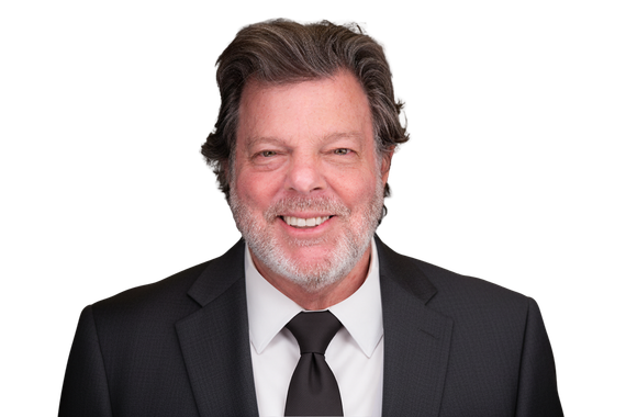 An aerial view of a city at night with lots of tall buildings