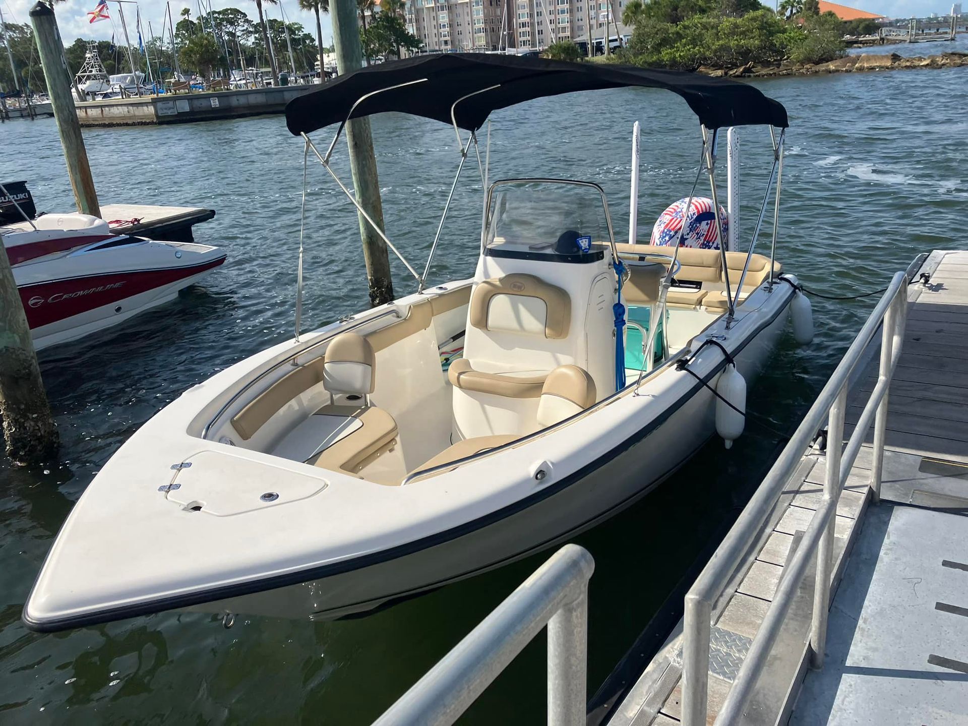 A boat is docked at a dock in the water