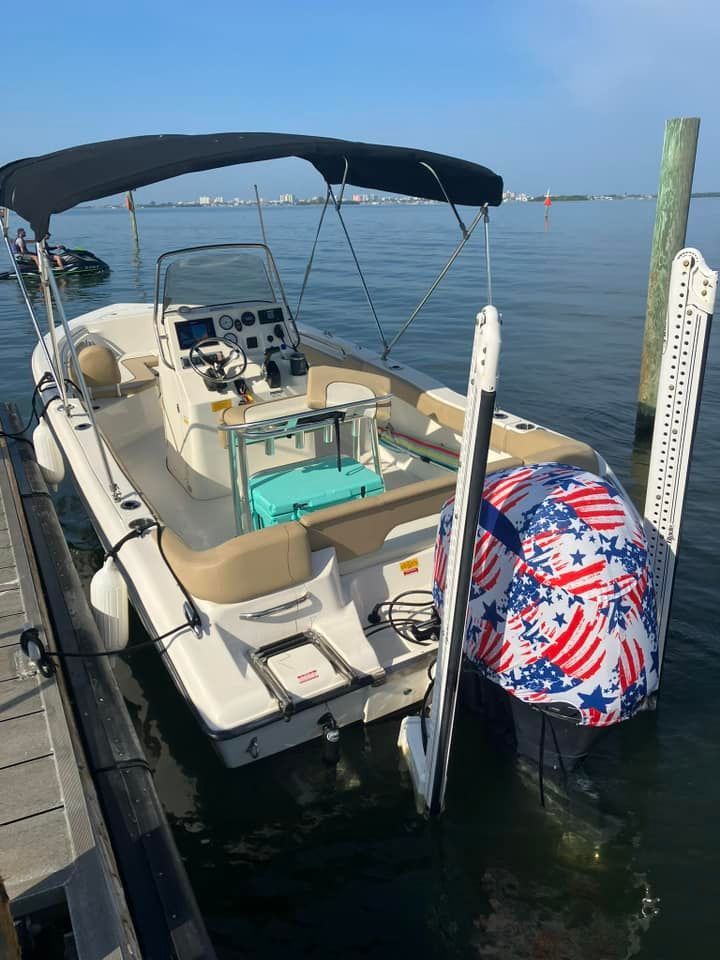 A boat is docked at a dock in the water.