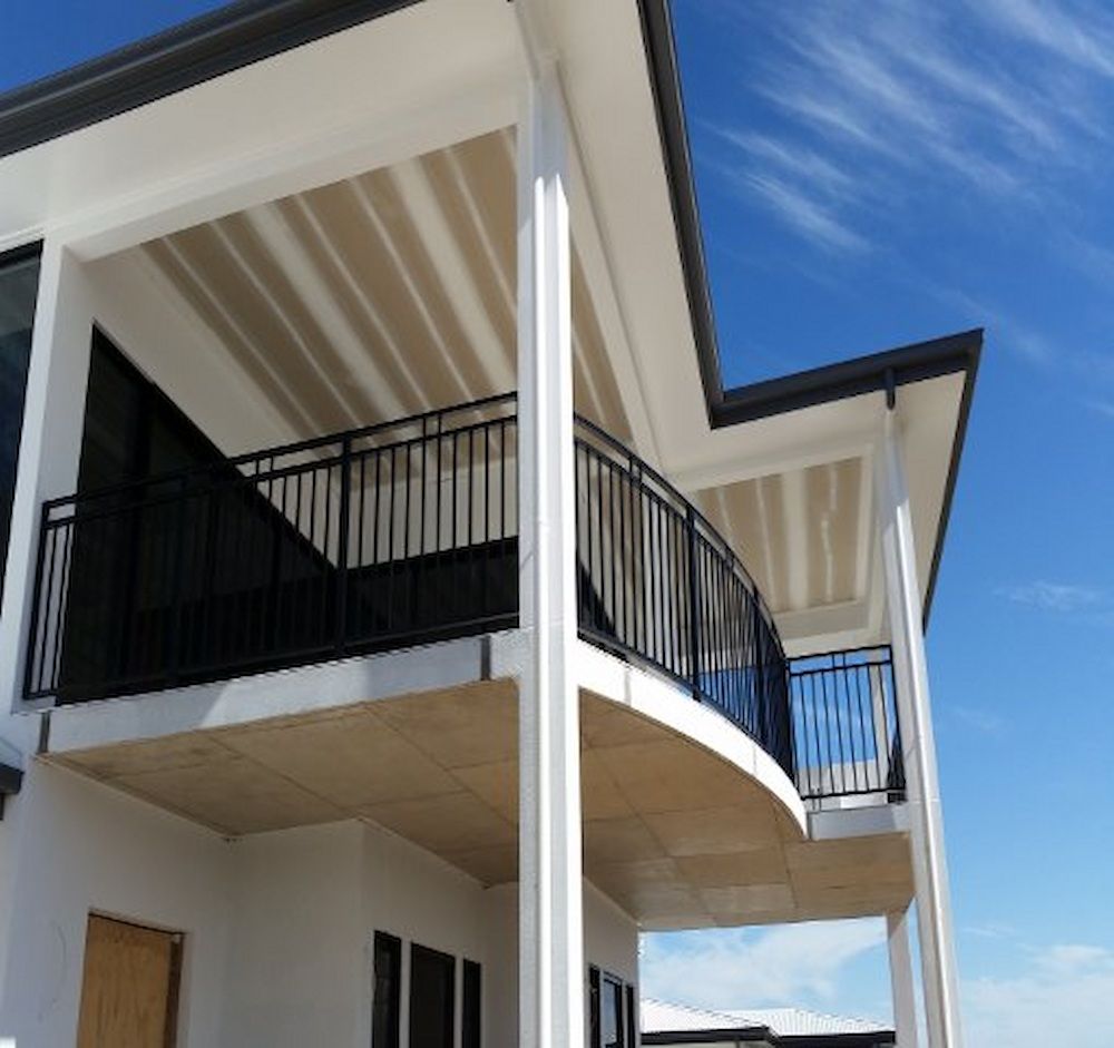 A House With A Balcony And A Blue Sky In The Background — Ward's Aluminium in Garbutt, QLD