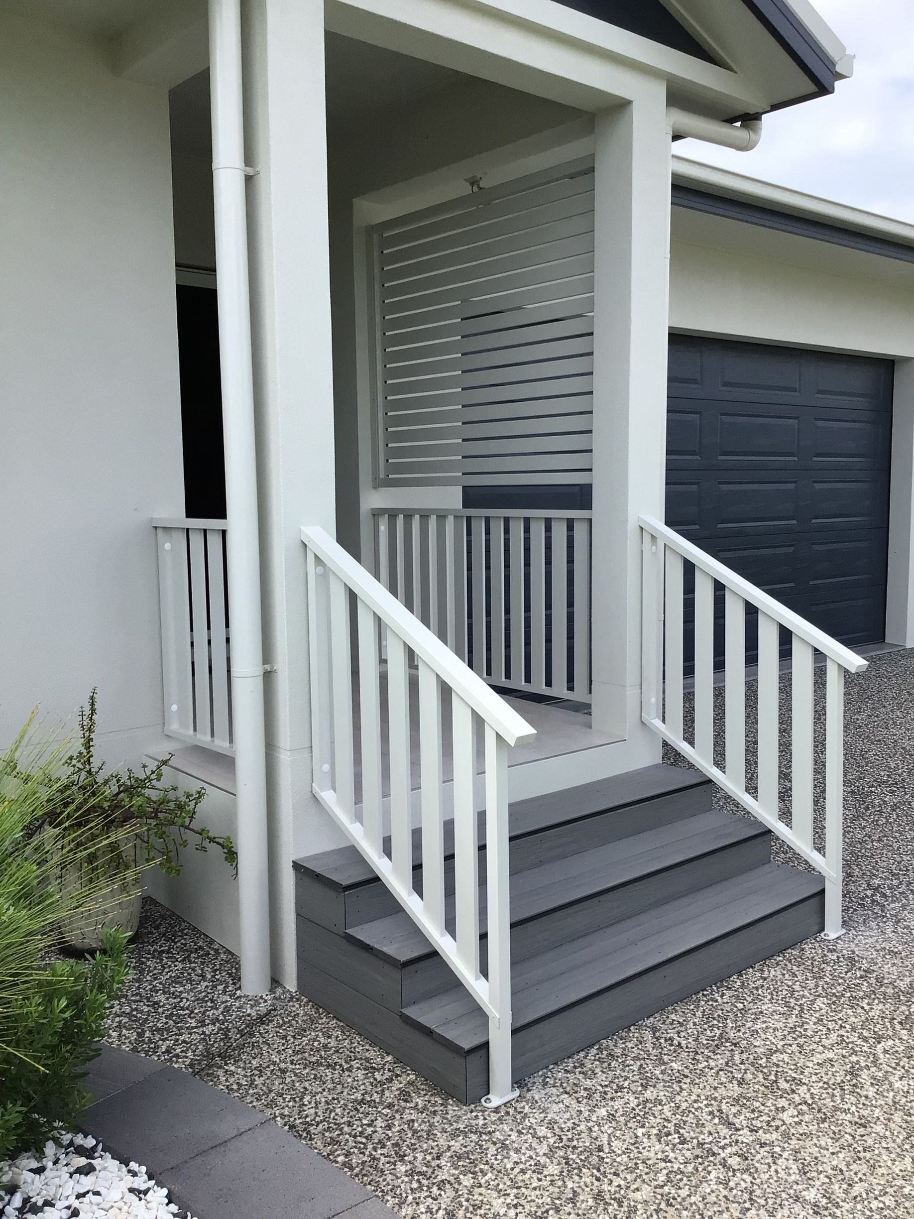 Entrance of a house with Grey steps and white fencing— Ward's Aluminium in Townsville, QLD