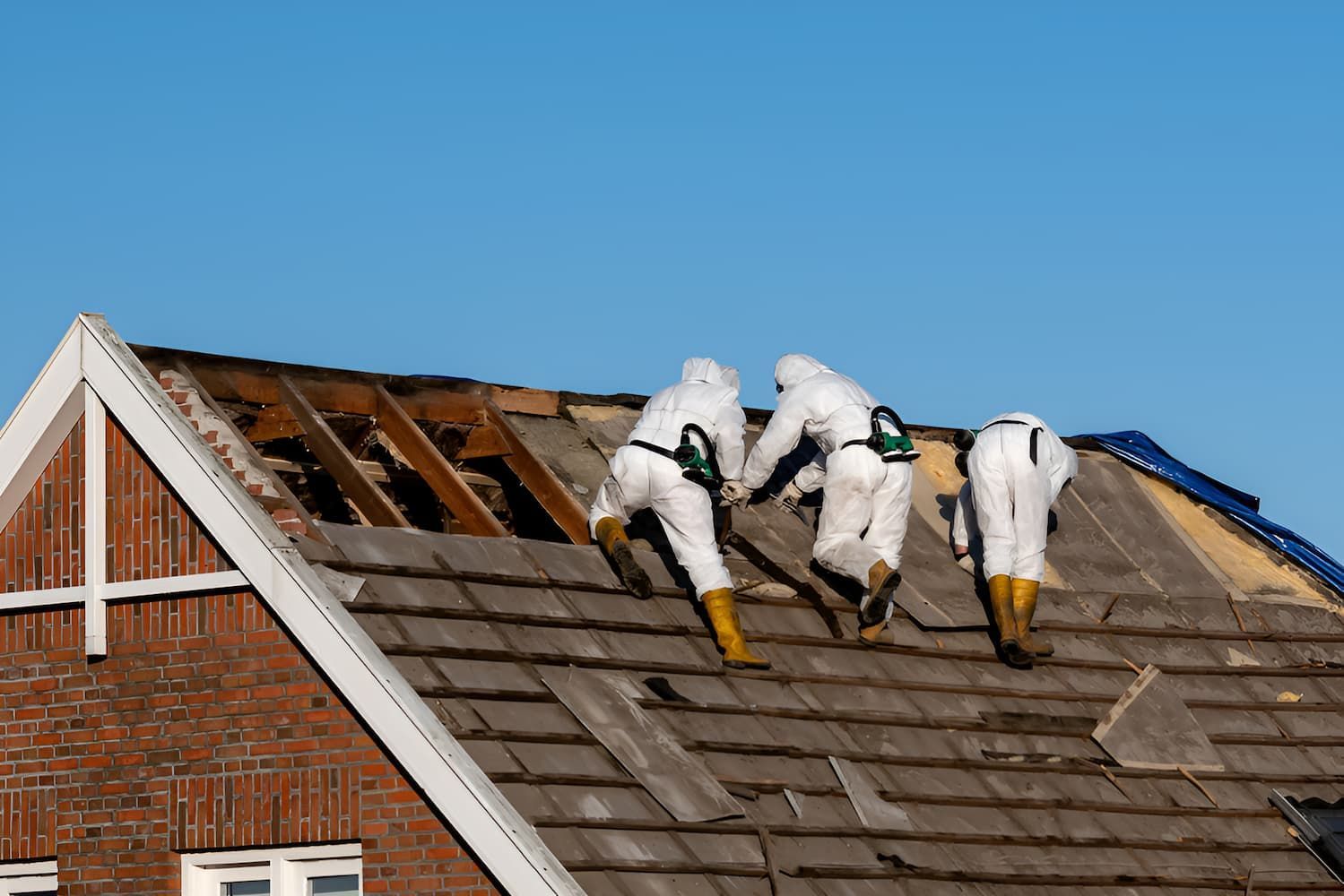 A Group of People Are Working on the Roof of a House — Veramax Industries in Mackay, QLD